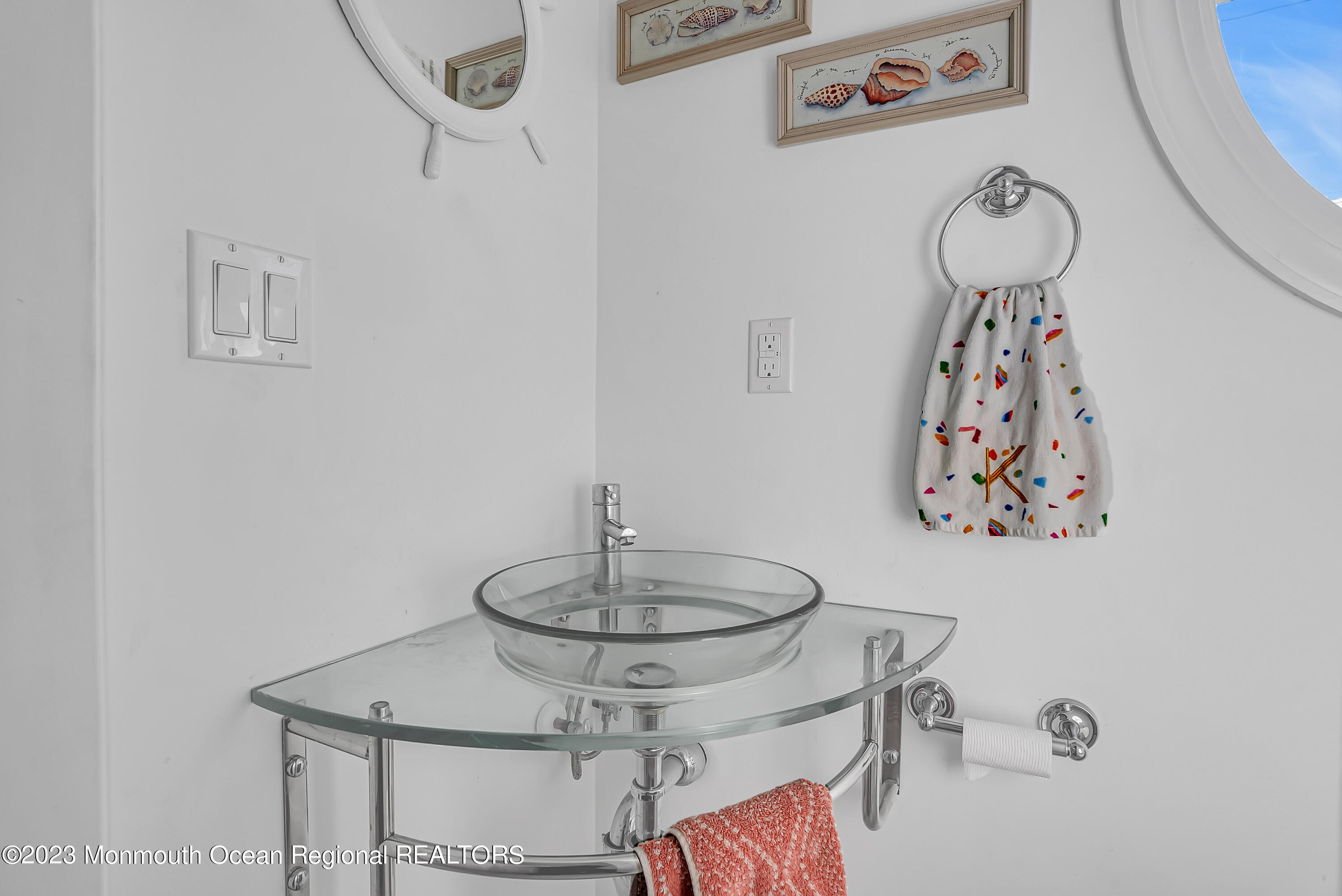26 East Shell Way Lavallette, NJ 08735 - Photo 23 of 46 a table with a vase and flowers in it
