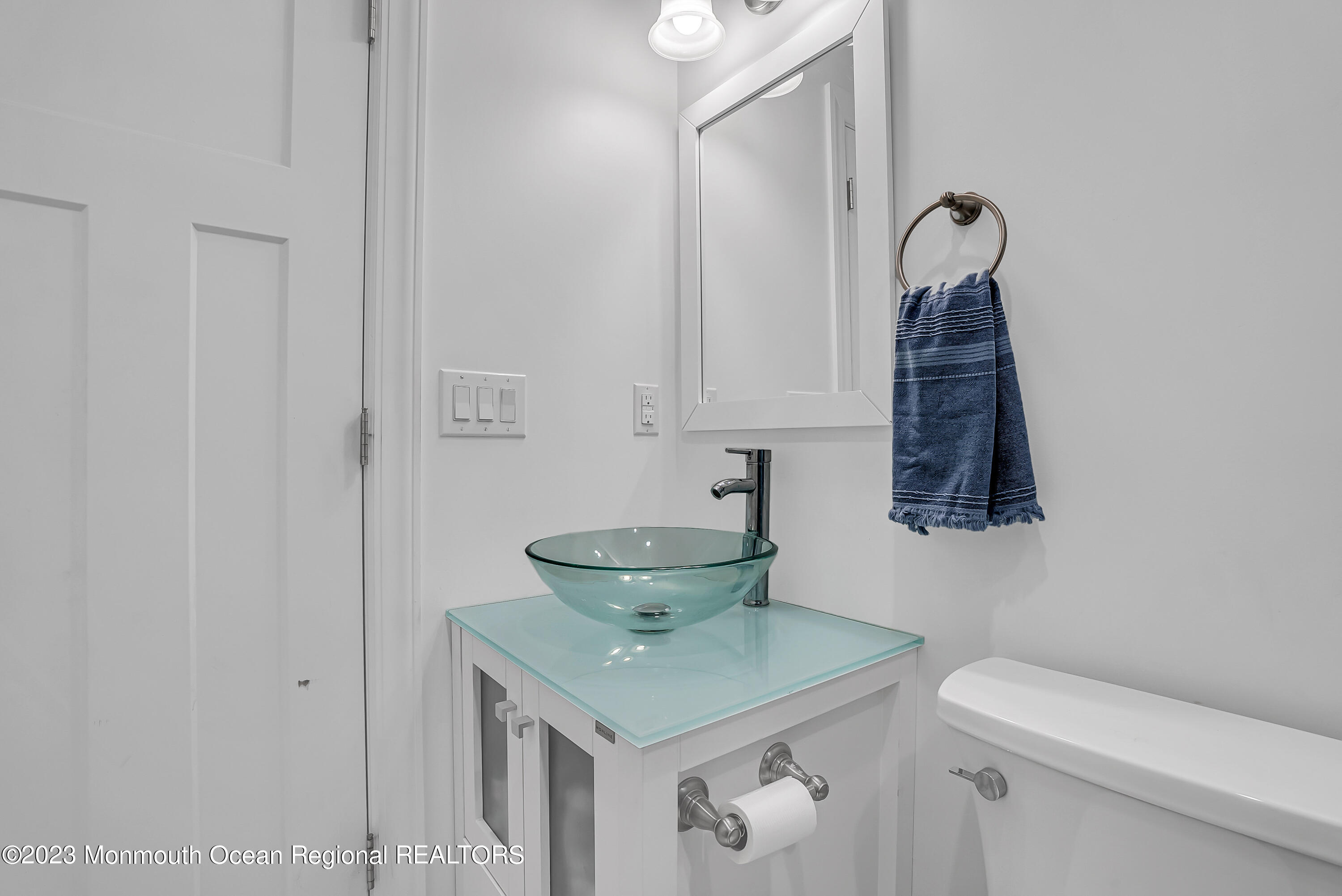 26 East Shell Way Lavallette, NJ 08735 - Photo 28 of 46 a bathroom with a granite countertop sink a toilet and a mirror