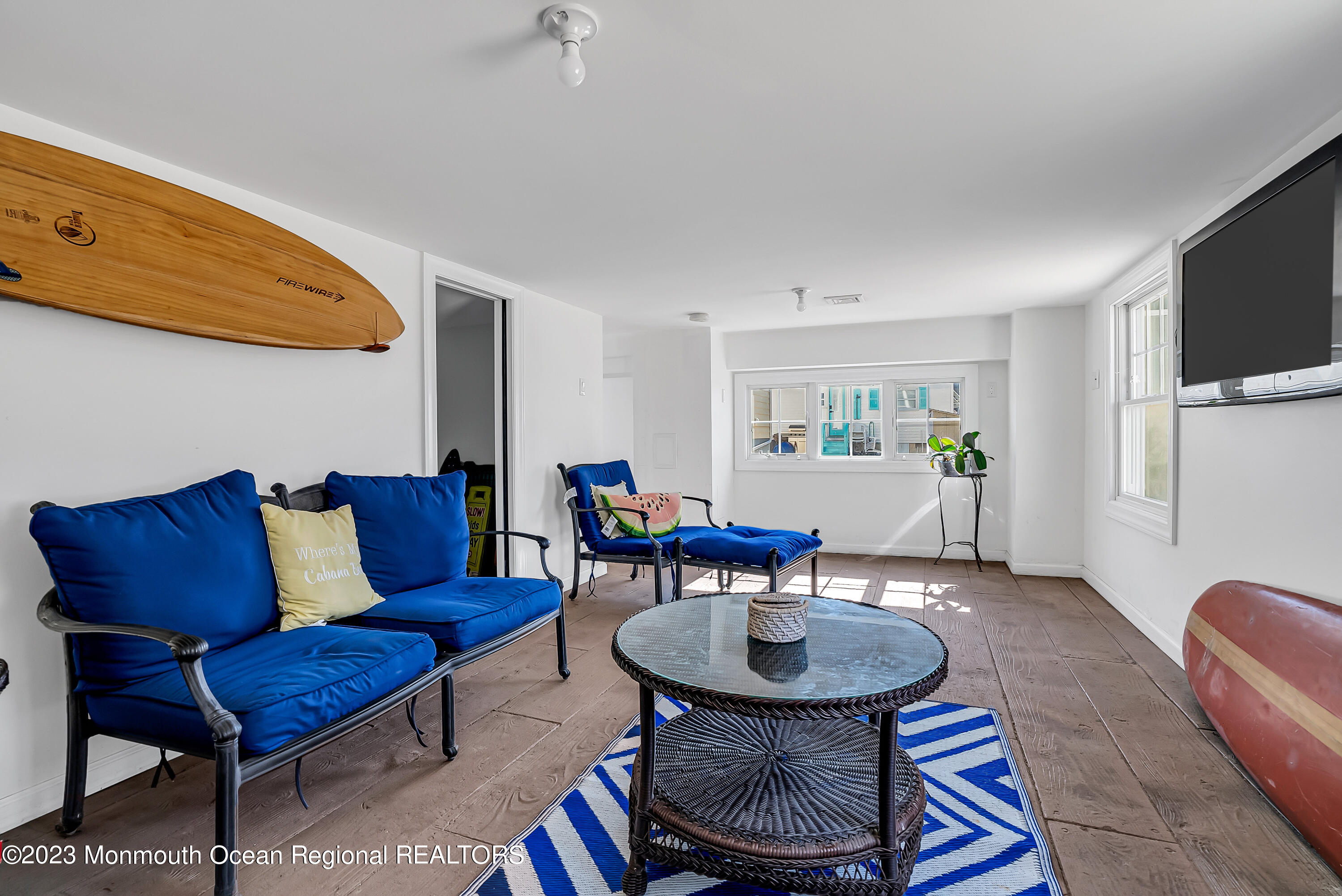 26 East Shell Way Lavallette, NJ 08735 - Photo 30 of 46 a living room with furniture a flat screen tv and kitchen view