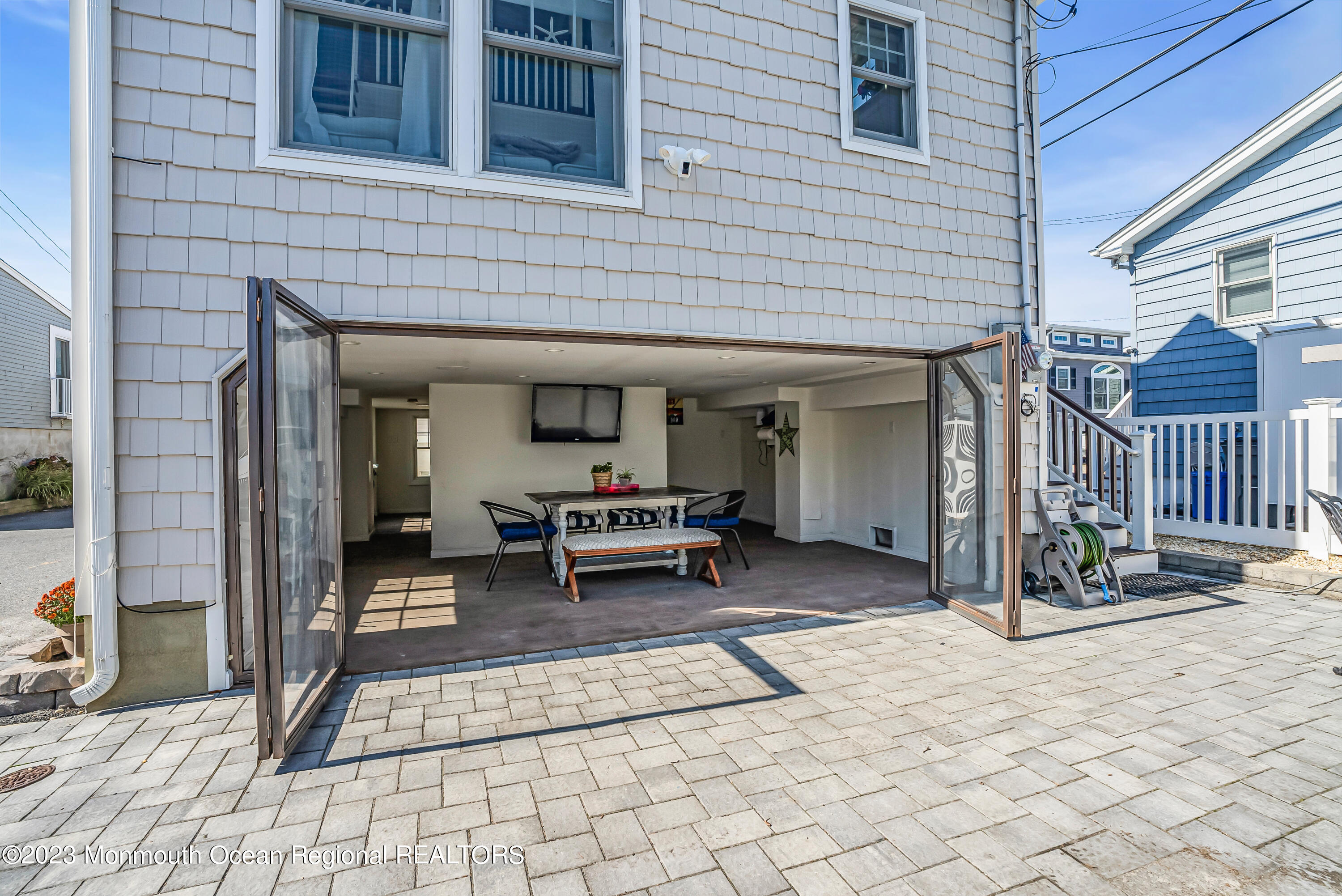 26 East Shell Way Lavallette, NJ 08735 - Photo 33 of 46 a view of a dinning room with a bench and table and chairs