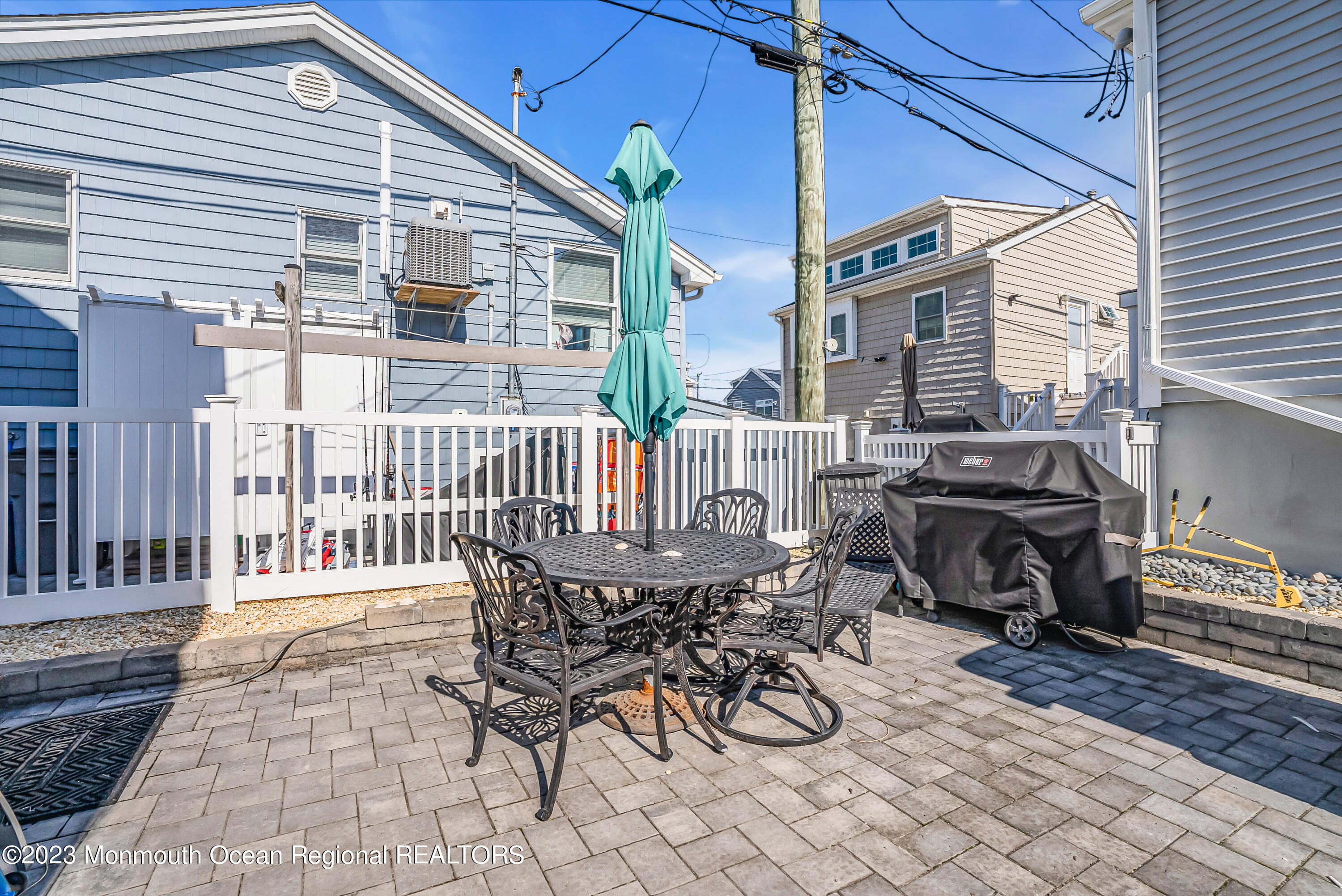 26 East Shell Way Lavallette, NJ 08735 - Photo 34 of 46 a view of a patio with a table and chairs