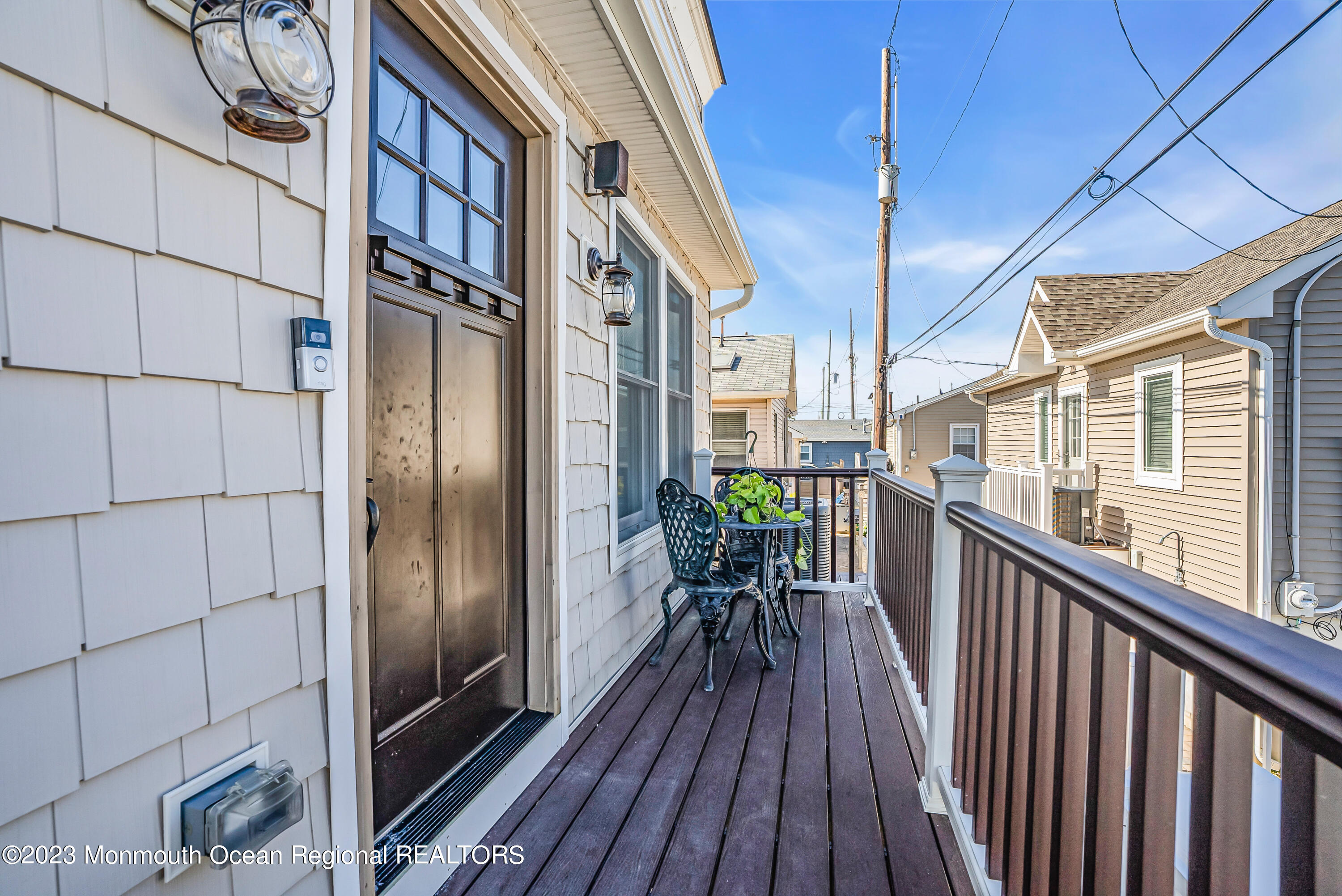 26 East Shell Way Lavallette, NJ 08735 - Photo 4 of 46 a view of a balcony with wooden floor