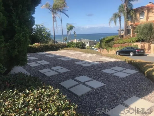 5616 Abalone Place La Jolla, CA 92037 - Photo 12 of 18 a view of a yard with plants and a fountain