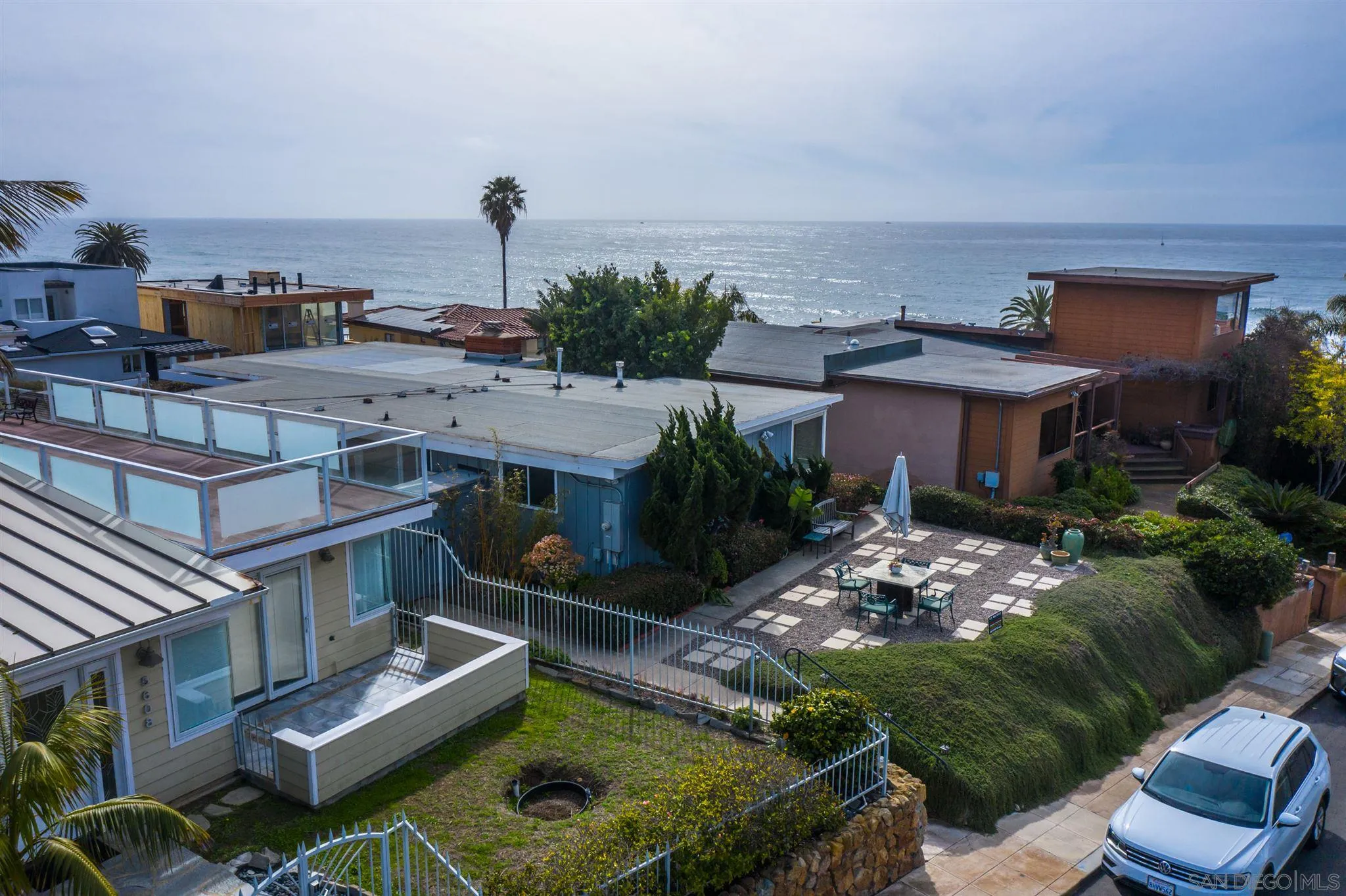 5616 Abalone Place La Jolla, CA 92037 - Photo 5 of 18 a view of a house with backyard outdoor seating area and barbeque oven