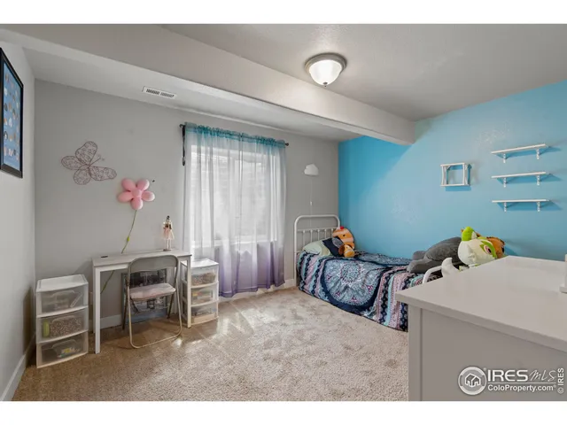 a bedroom with furniture and a bed