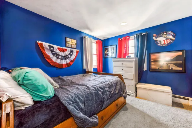 a bedroom with bed and window