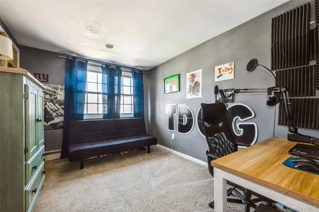 a bedroom with bed and a window