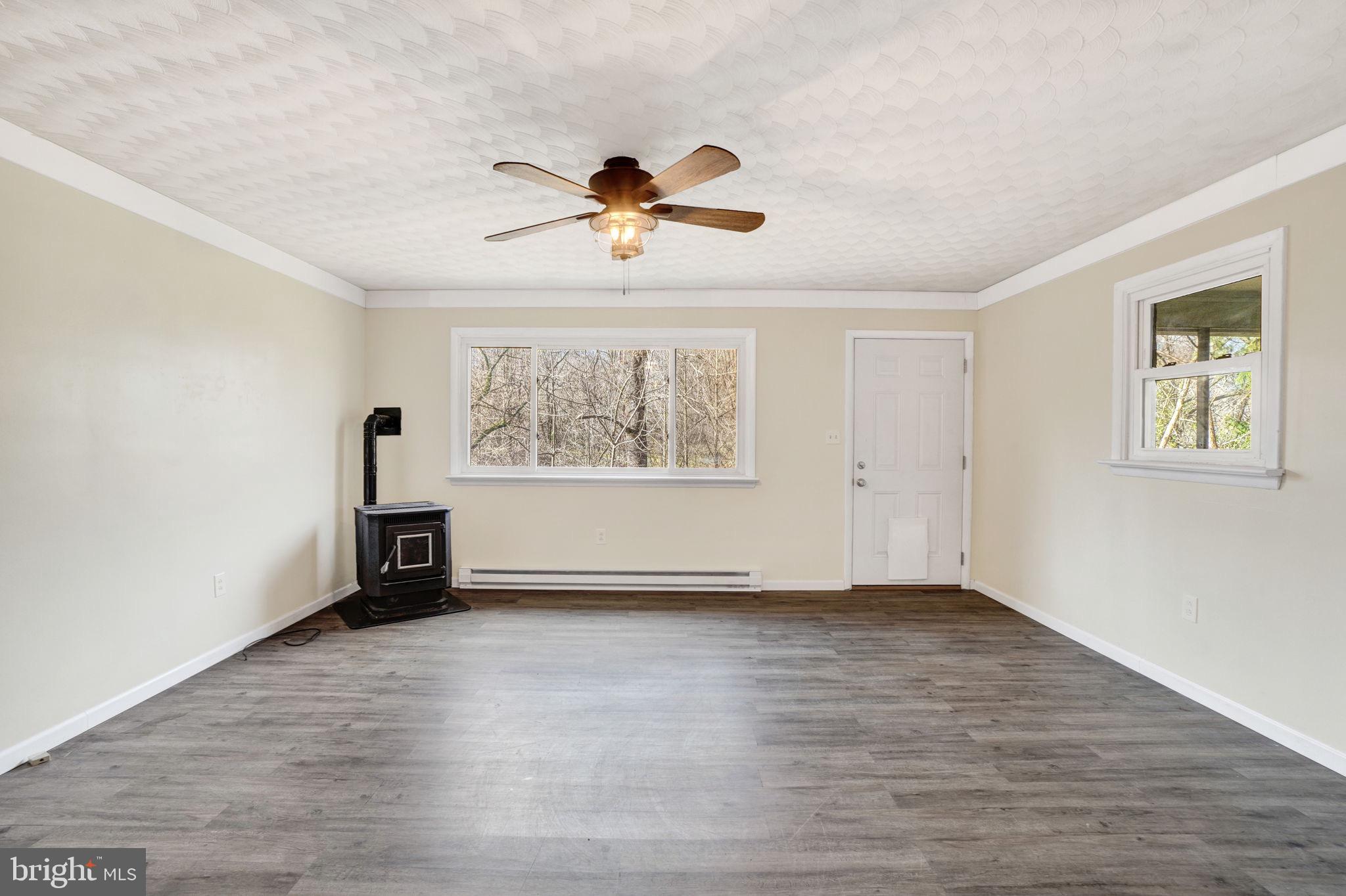5714 Spruce Road Felton, PA 17322 - Photo 12 of 33 wooden floor in an empty room with a window