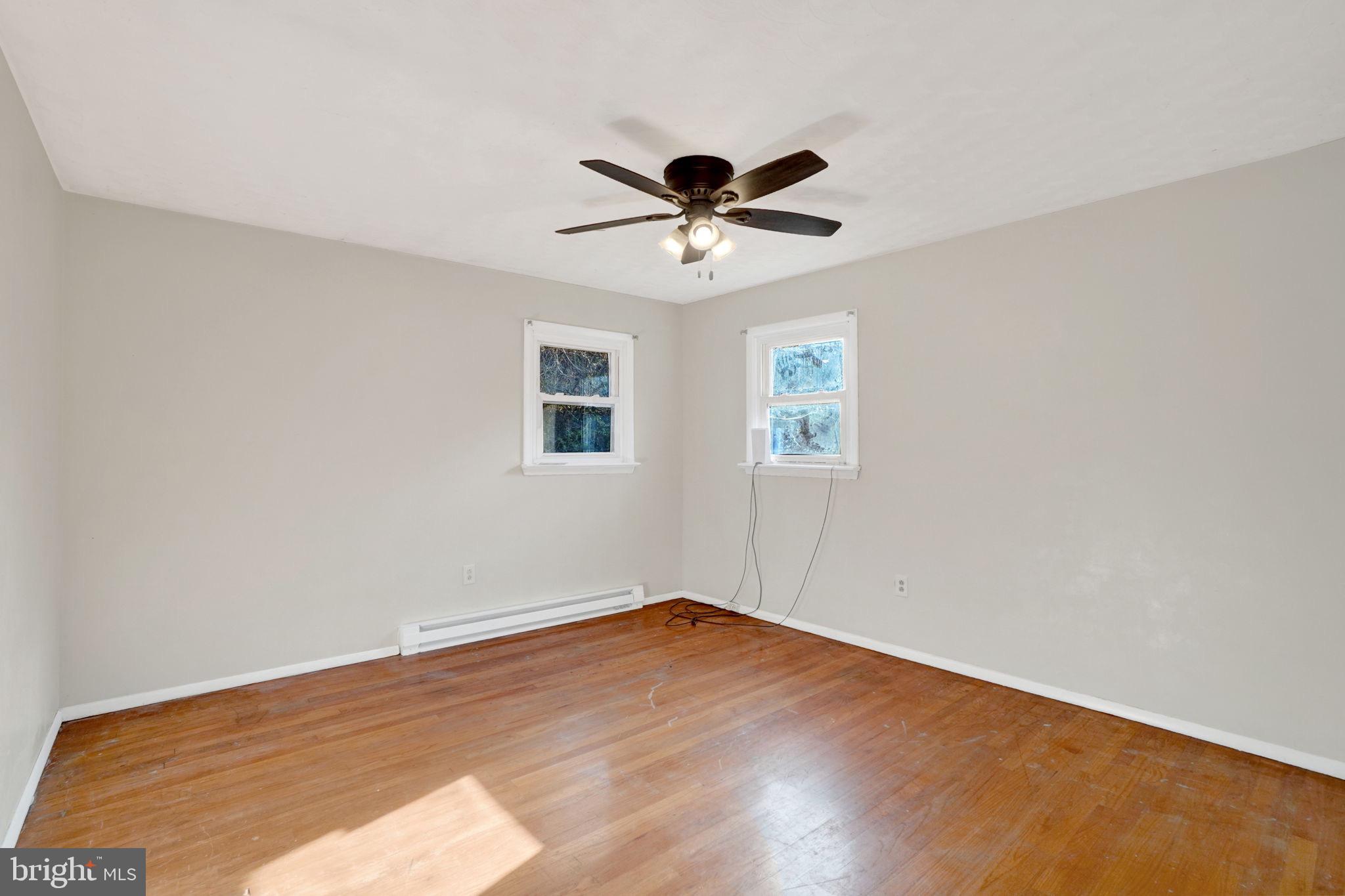 5714 Spruce Road Felton, PA 17322 - Photo 14 of 33 a view of a big room with wooden floor and windows in a room