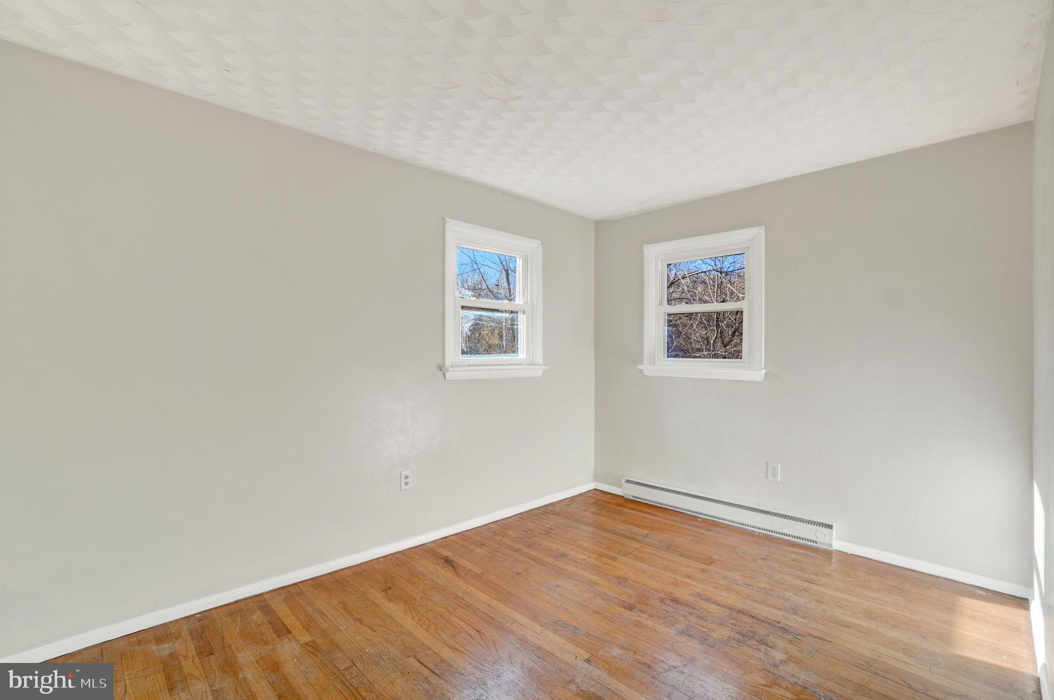 5714 Spruce Road Felton, PA 17322 - Photo 15 of 33 a view of a big room with wooden floor and windows