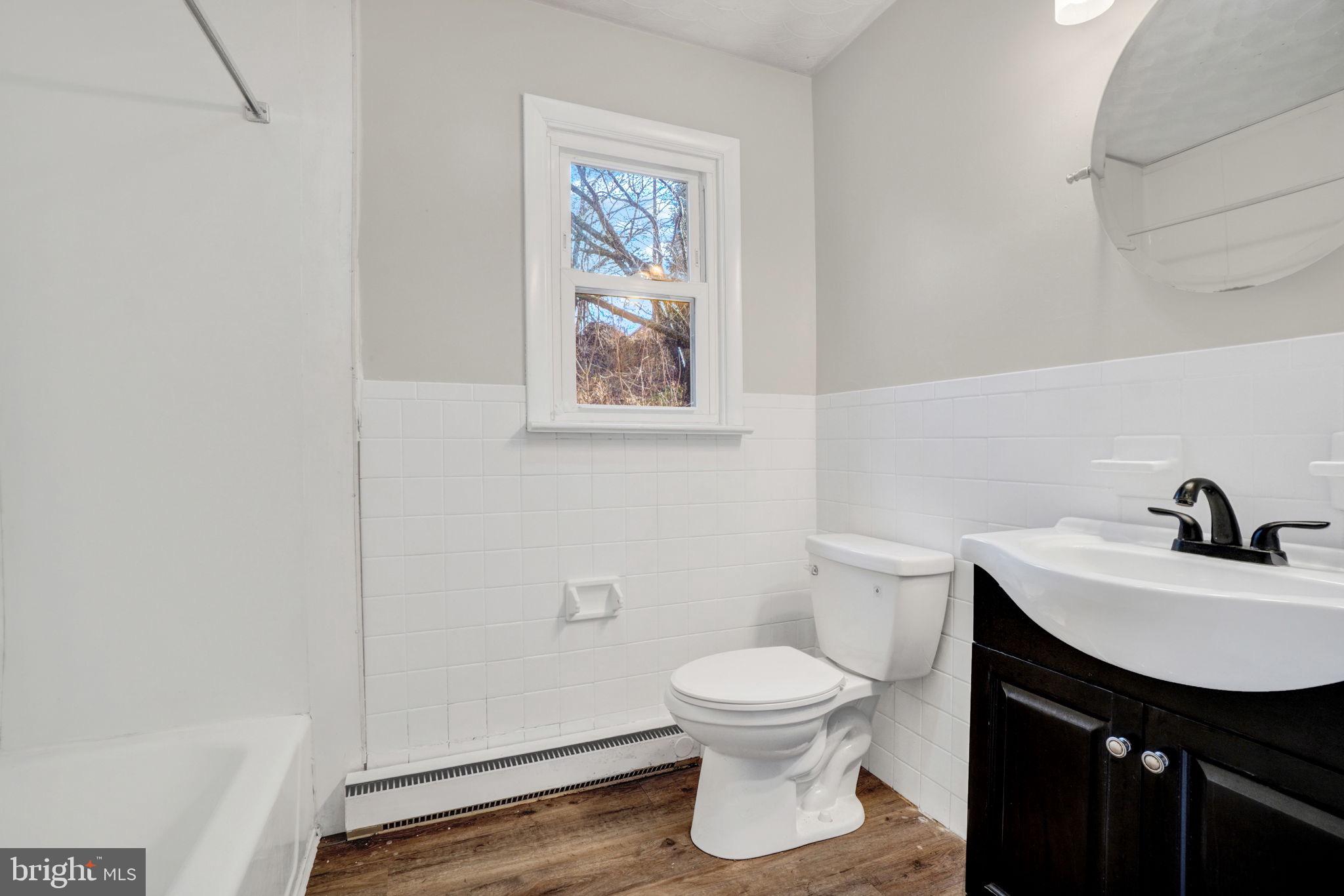 5714 Spruce Road Felton, PA 17322 - Photo 17 of 33 a white toilet sitting next to a bathroom sink