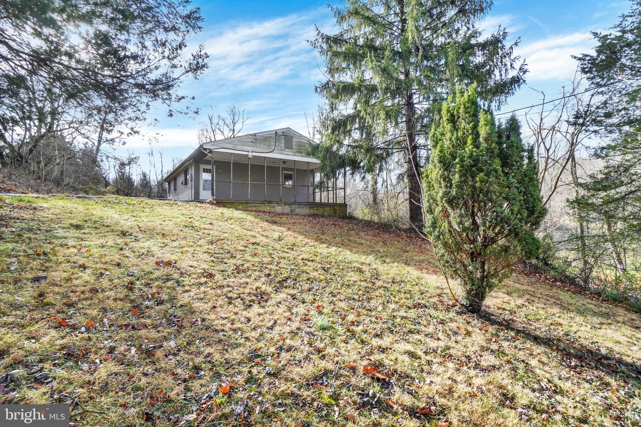 5714 Spruce Road Felton, PA 17322 - Photo 25 of 33 a front view of a house with a garden