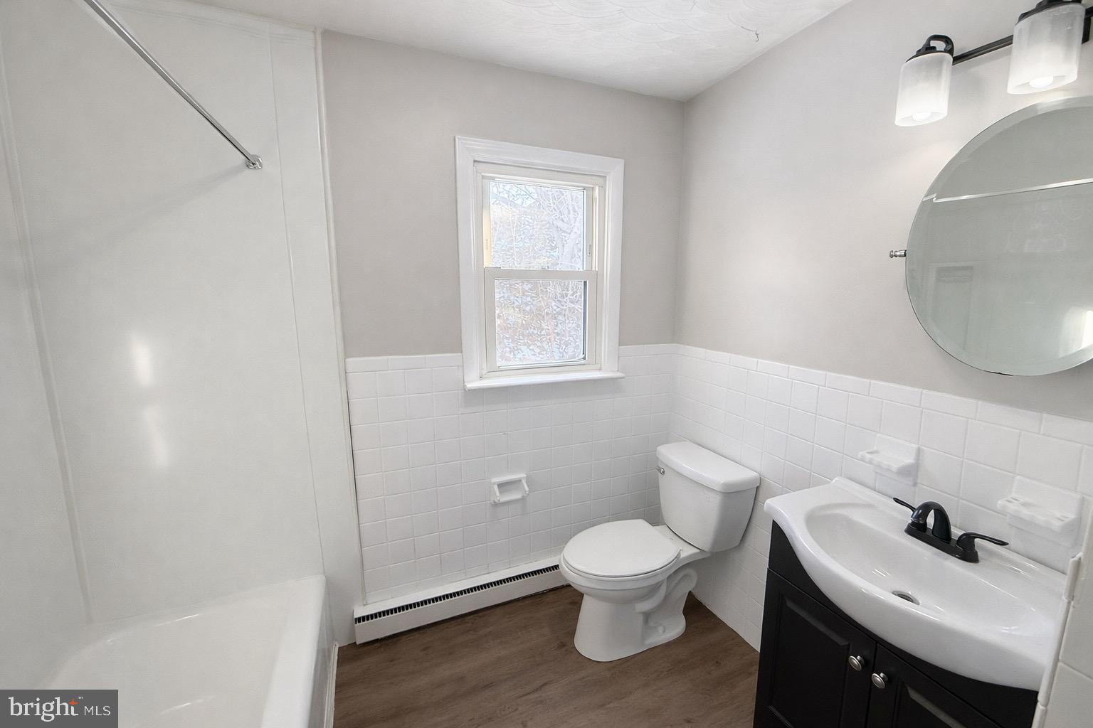 5714 Spruce Road Felton, PA 17322 - Photo 4 of 33 a white toilet sitting next to a bathroom sink