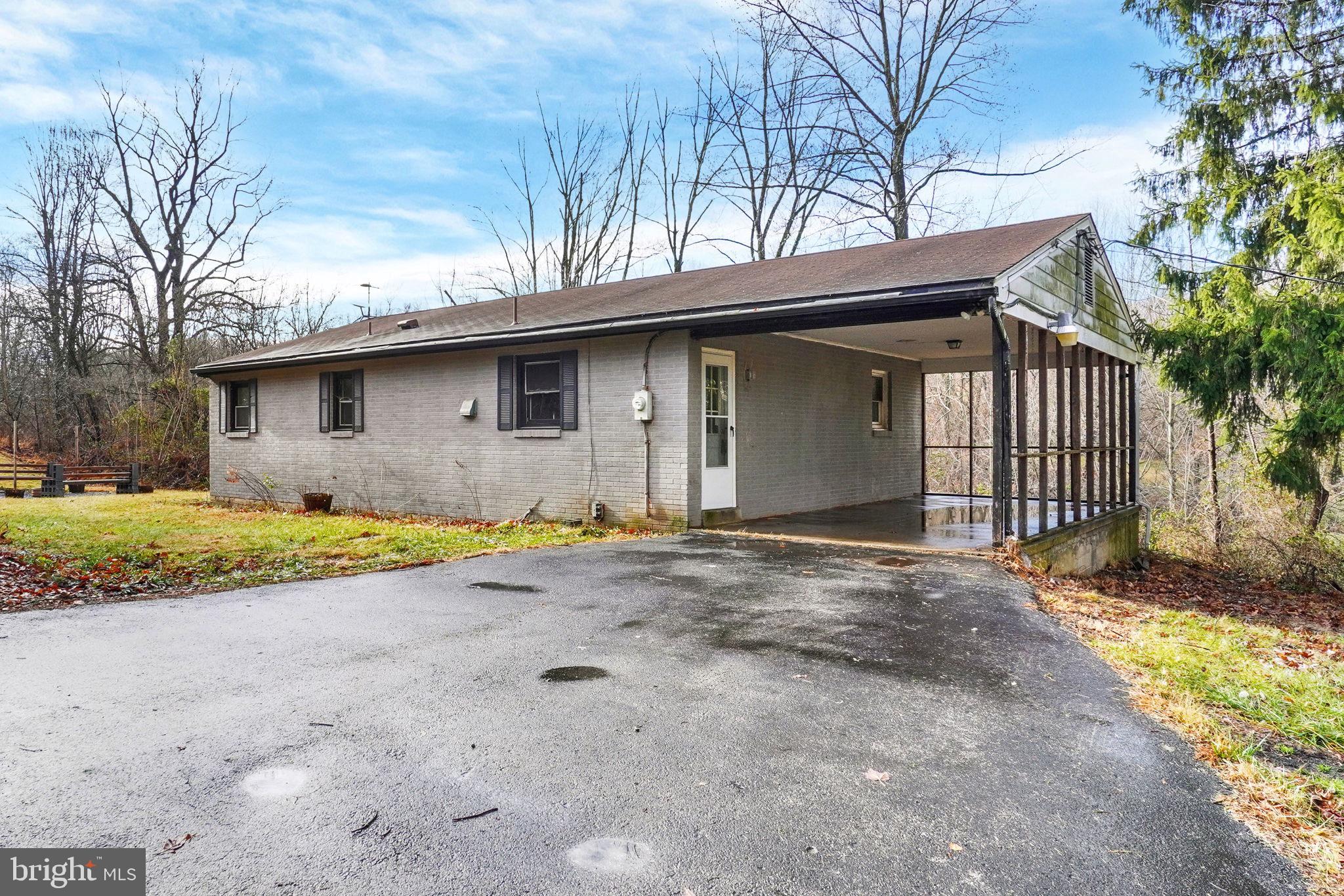 5714 Spruce Road Felton, PA 17322 - Photo 8 of 33 a front view of a house with a yard and garage