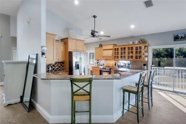 a view of a kitchen and dining room