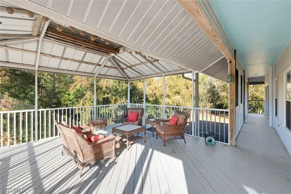 a view of deck with couch and wooden floor