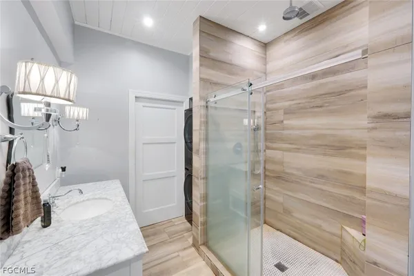 a bathroom with a shower and a sink