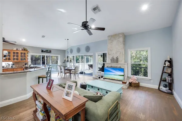 a living room with furniture a window and gym equipment