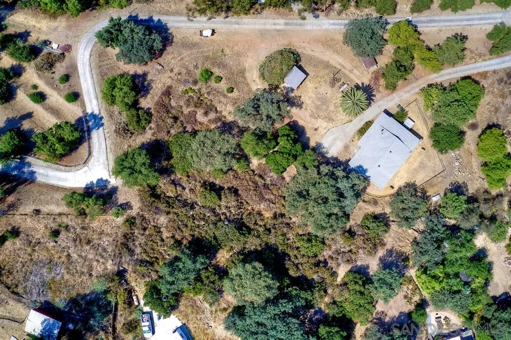 14941 Lyons Valley Road Jamul, CA 91935 - Photo 18 of 24 an aerial view of a house with a yard and garden