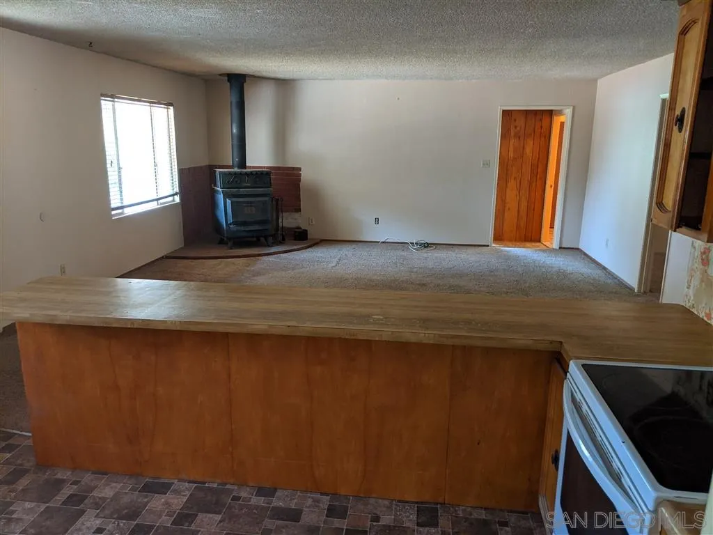 14941 Lyons Valley Road Jamul, CA 91935 - Photo 3 of 24 a bedroom with a bed and a window