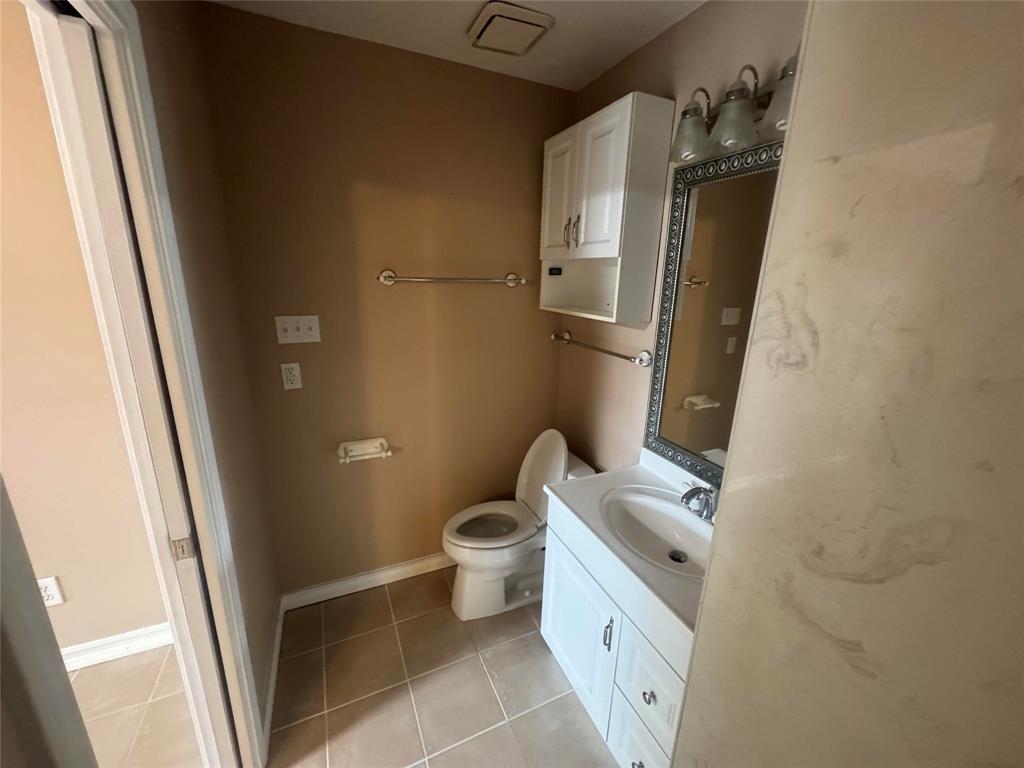 4649 Misty Ridge Drive Fort Worth, TX 76137 - Photo 21 of 25 a bathroom with a sink and toilet