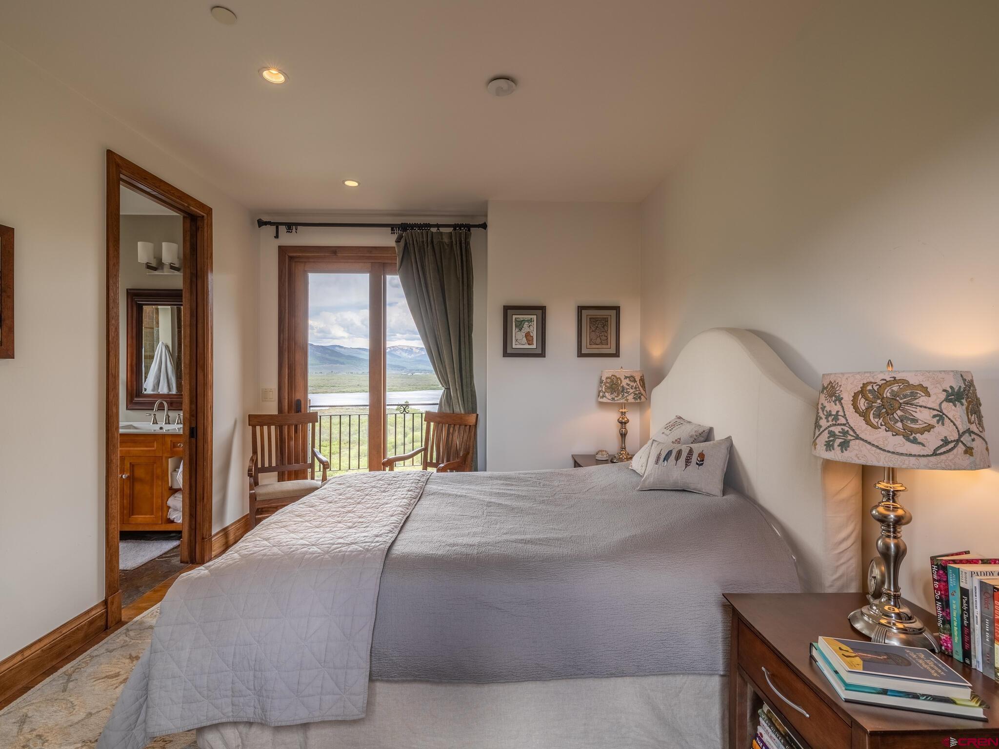 1482 Peanut Lake Road Crested Butte, CO 81224 - Photo 13 of 29 a bedroom with a large bed and a window