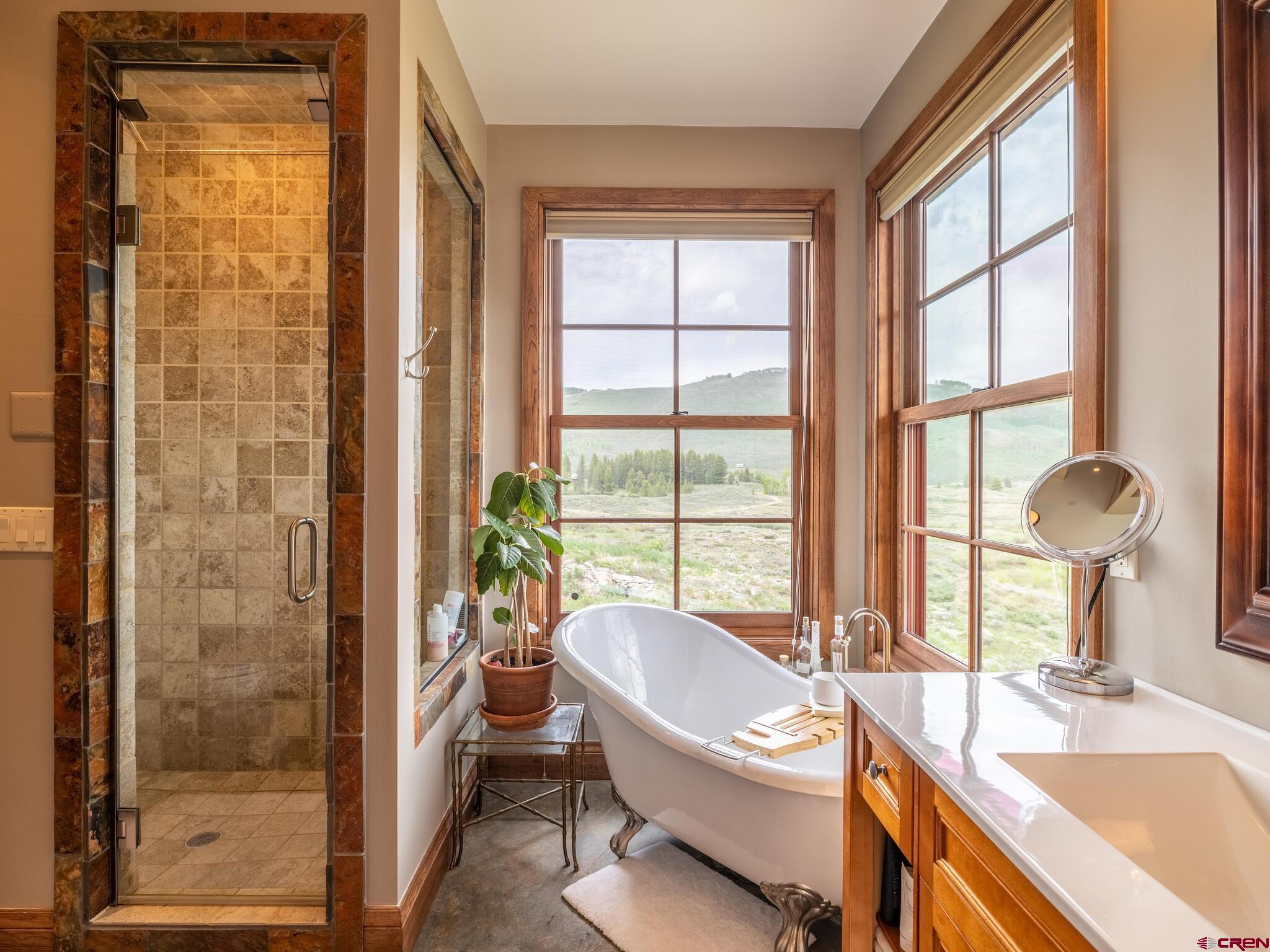1482 Peanut Lake Road Crested Butte, CO 81224 - Photo 14 of 29 a living room with a large window and furniture
