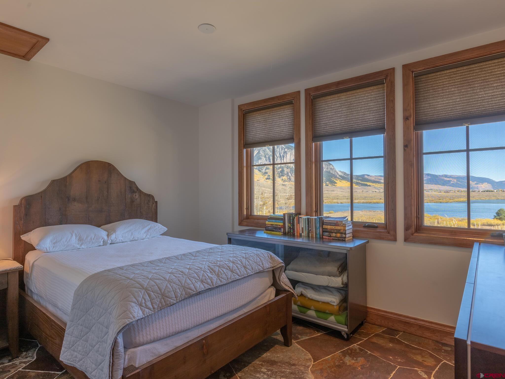 1482 Peanut Lake Road Crested Butte, CO 81224 - Photo 15 of 29 a bedroom with a bed and a window