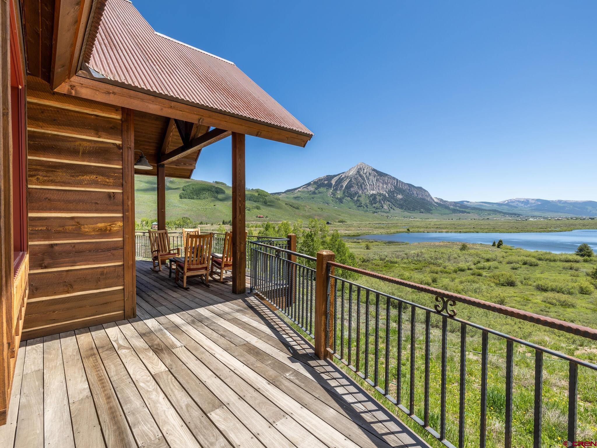 1482 Peanut Lake Road Crested Butte, CO 81224 - Photo 18 of 29 a view of a chairs and table on the wooden deck