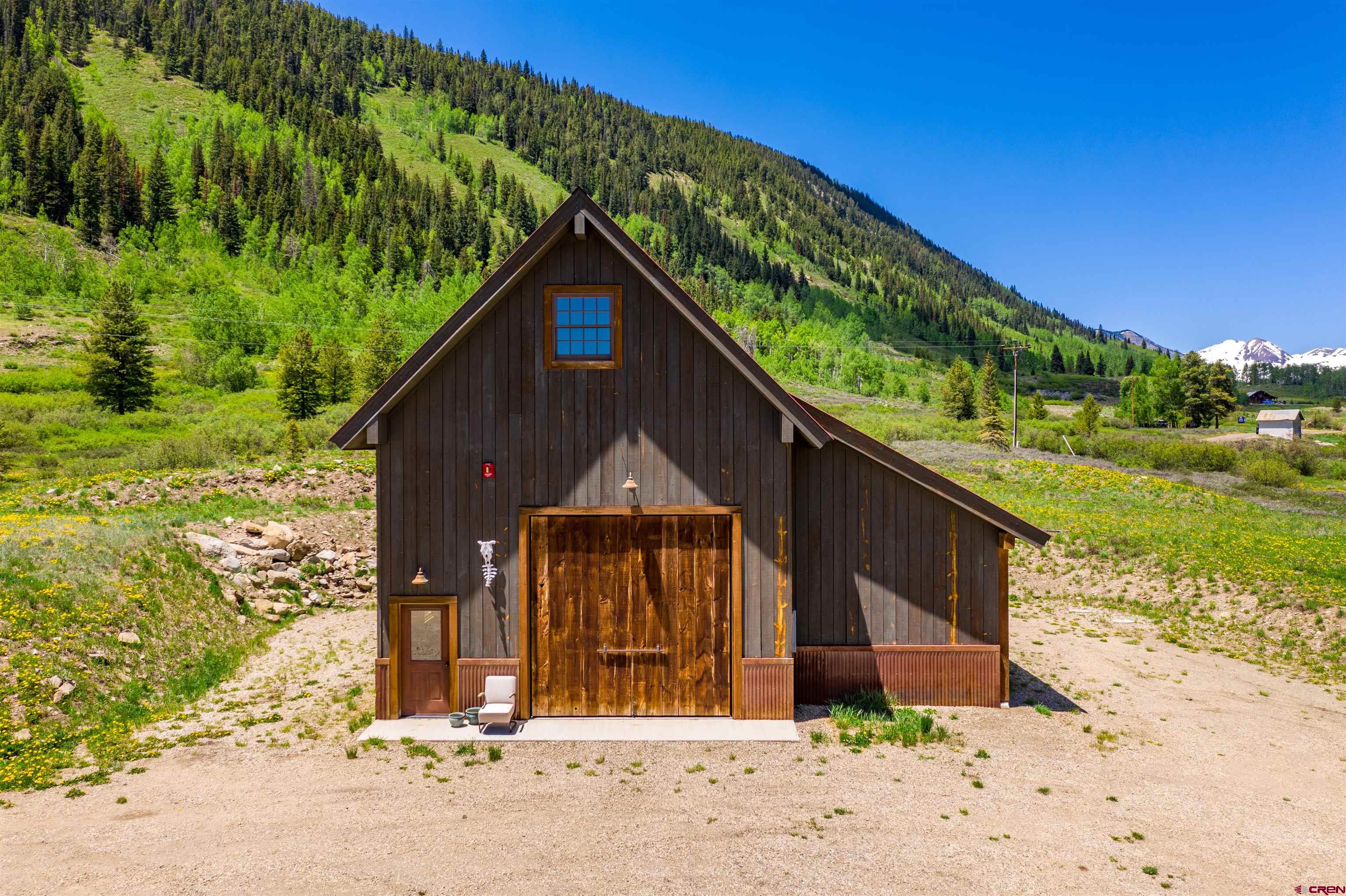 1482 Peanut Lake Road Crested Butte, CO 81224 - Photo 25 of 29 a front view of a house with a yard