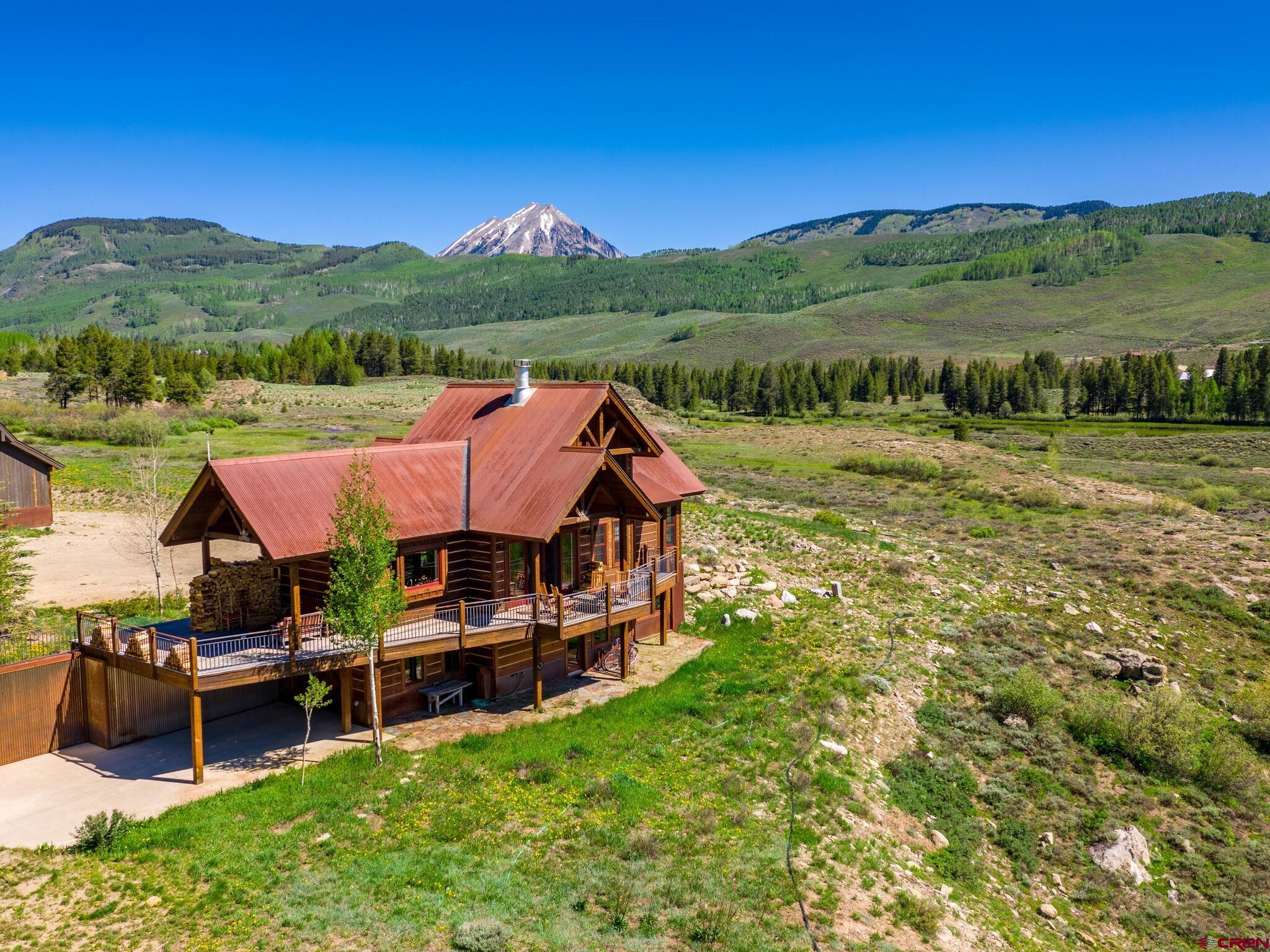1482 Peanut Lake Road Crested Butte, CO 81224 - Photo 26 of 29 a view of a house with pool and a yard
