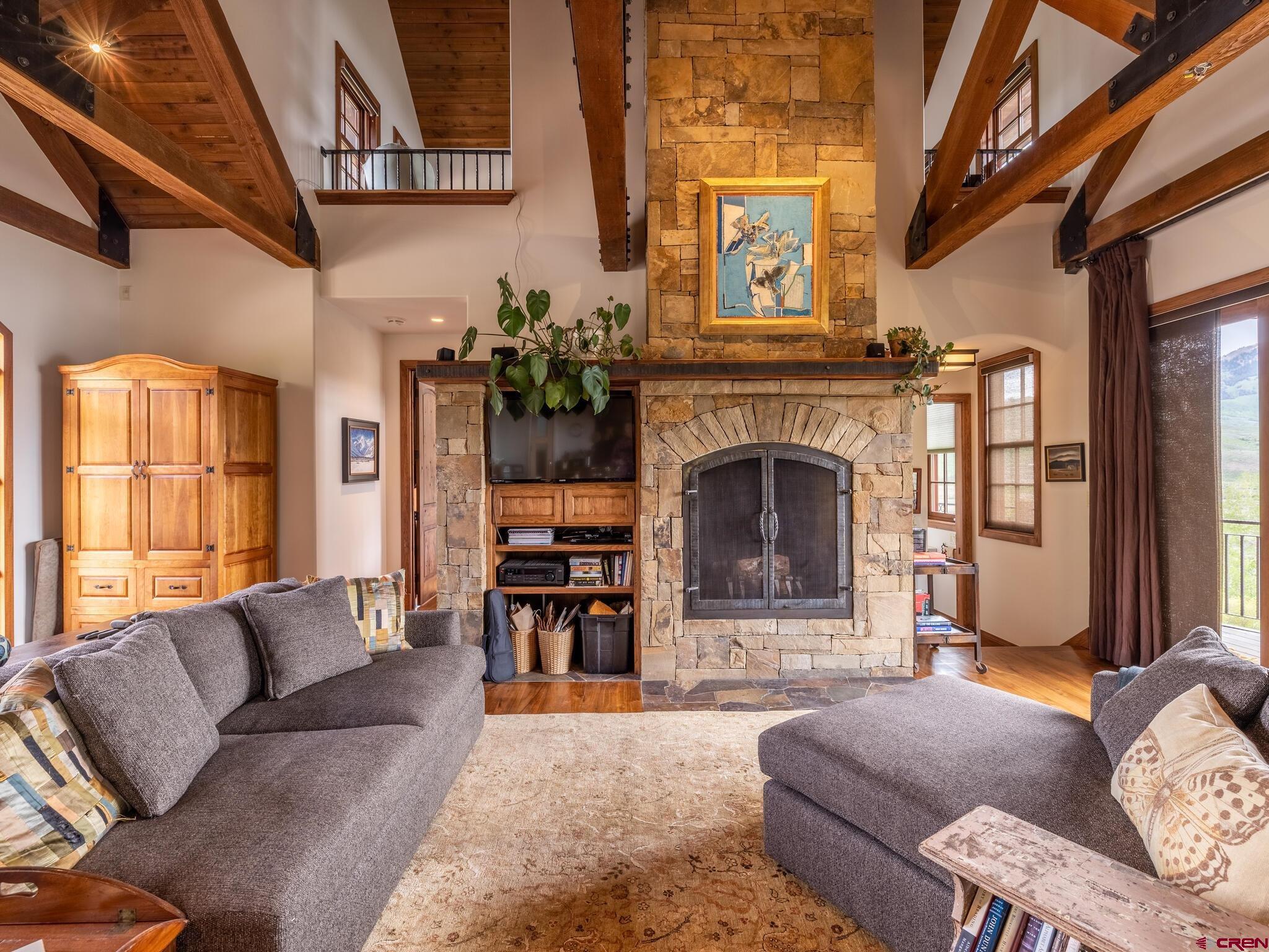 1482 Peanut Lake Road Crested Butte, CO 81224 - Photo 7 of 29 a living room with furniture and a fireplace
