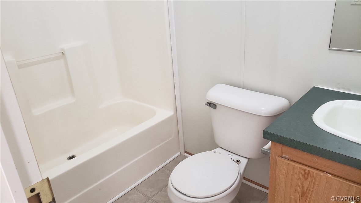 2021 Five Forks Road Pamplin, VA 23958 - Photo 7 of 11 a white toilet sitting next to a bath tub
