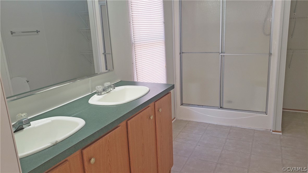 2021 Five Forks Road Pamplin, VA 23958 - Photo 9 of 11 a bathroom with a granite countertop sink and a mirror