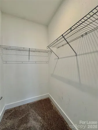 a bathroom with a sink mirror toilet and shower