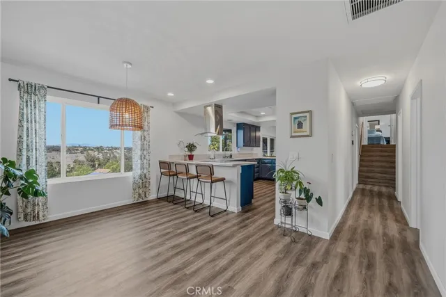 a bed room with a bed and a flat tv screen