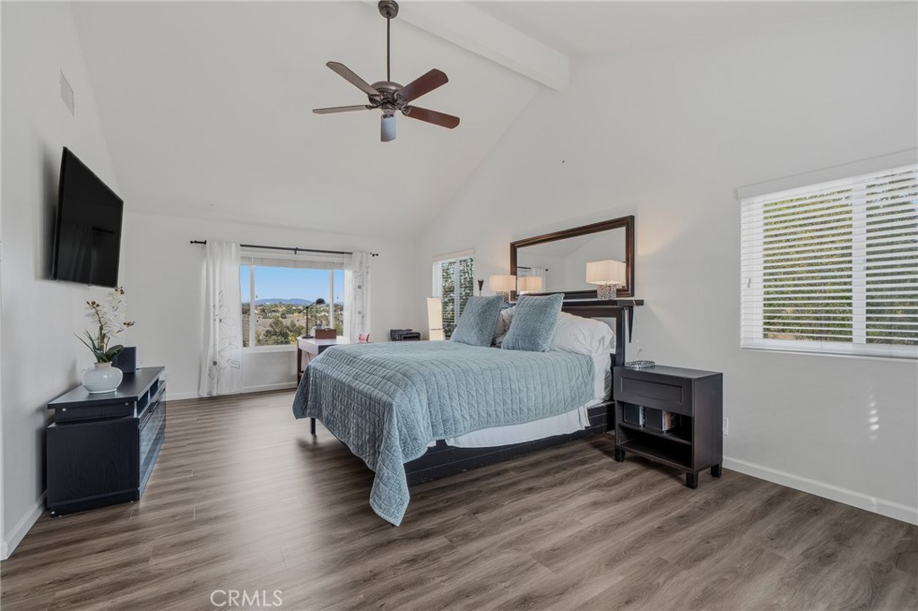 1864 Winterwarm Drive Fallbrook, CA 92028 - Photo 21 of 48 a bedroom with a bed and a chandelier