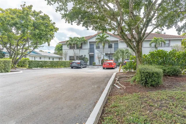a view of a street with houses on both side
