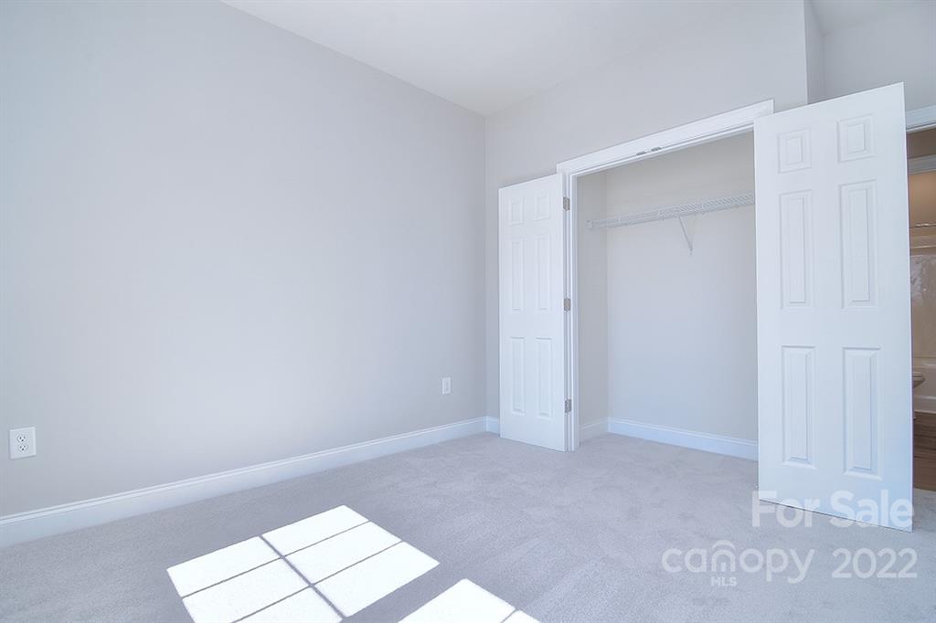 288 Ella Drive, Unit 101 Locust, NC 28097 - Photo 18 of 28 a view of an empty room