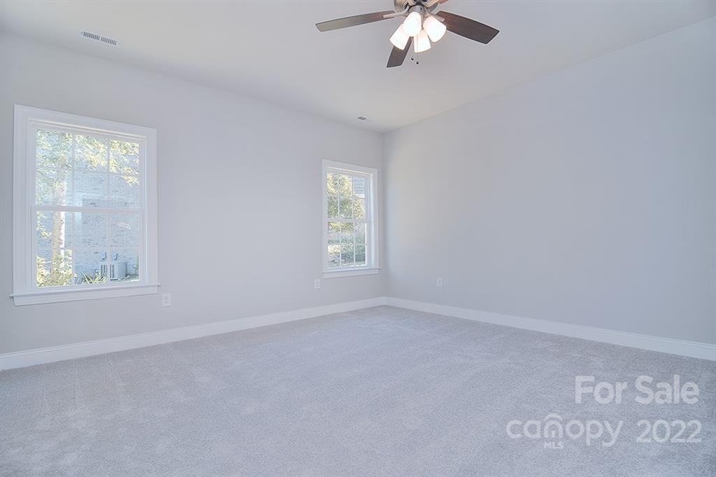 288 Ella Drive, Unit 101 Locust, NC 28097 - Photo 22 of 28 an empty room with a window