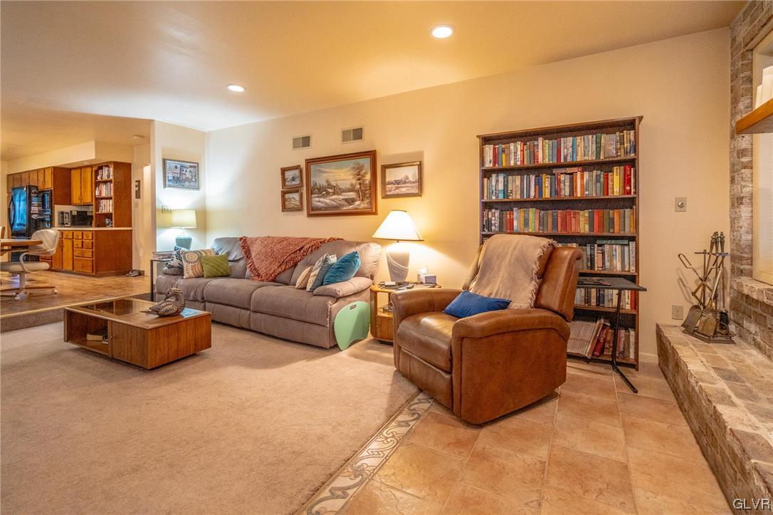 1540 Hidden Valley Road Allentown, PA 18103 - Photo 14 of 42 a living room with furniture and a book shelf