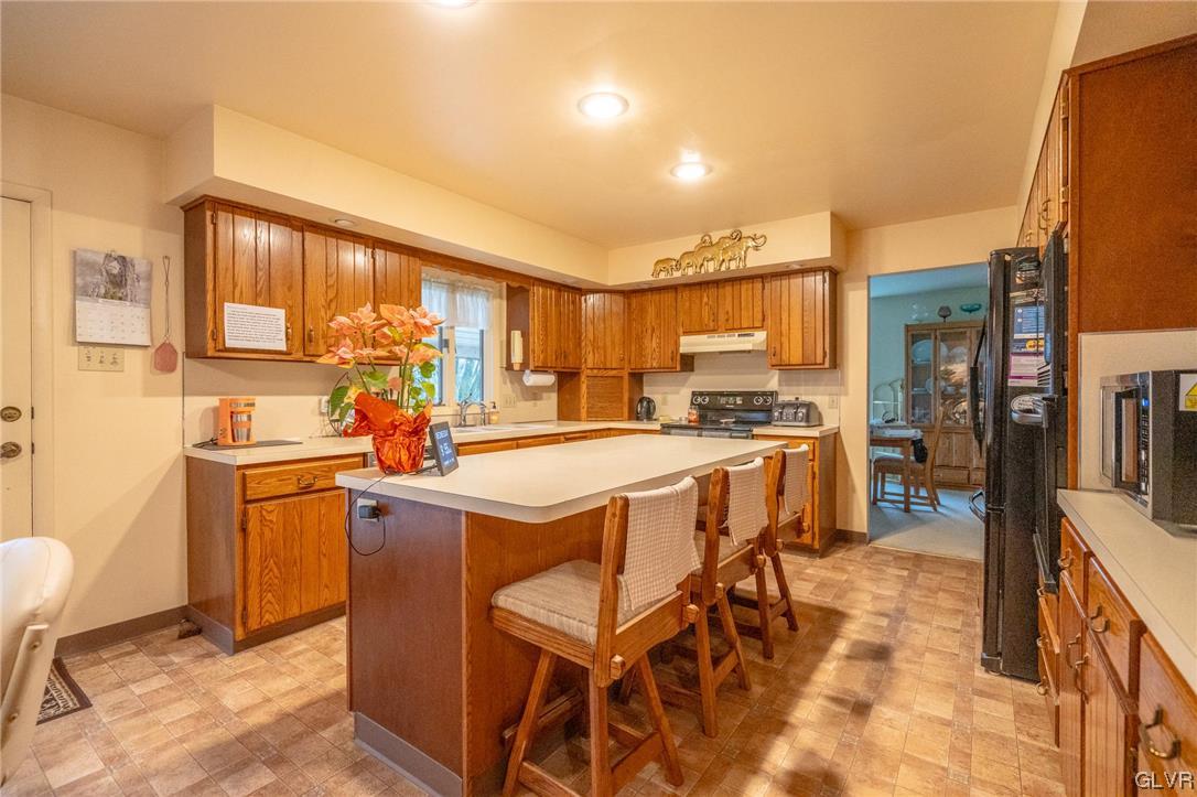 1540 Hidden Valley Road Allentown, PA 18103 - Photo 16 of 42 a kitchen with a sink appliances and cabinets