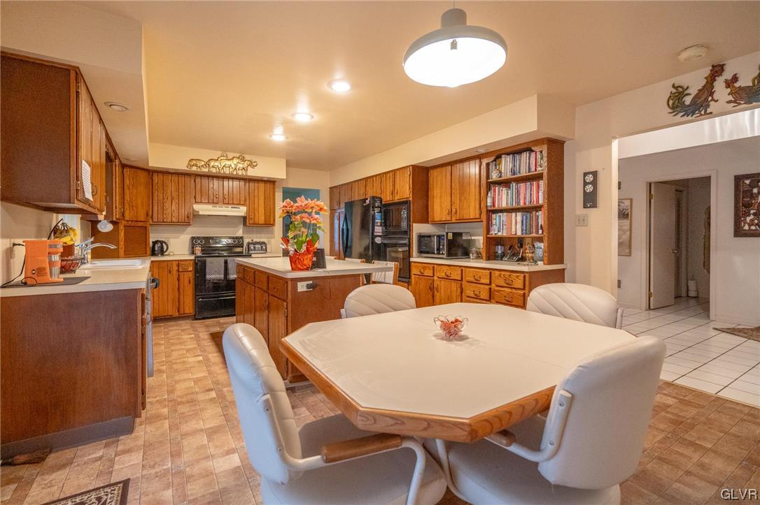1540 Hidden Valley Road Allentown, PA 18103 - Photo 19 of 42 a large kitchen with a table and chairs