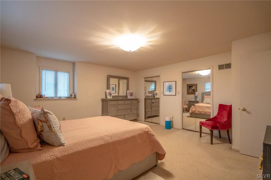 1540 Hidden Valley Road Allentown, PA 18103 - Photo 26 of 42 a spacious bedroom with a bed a table and chair