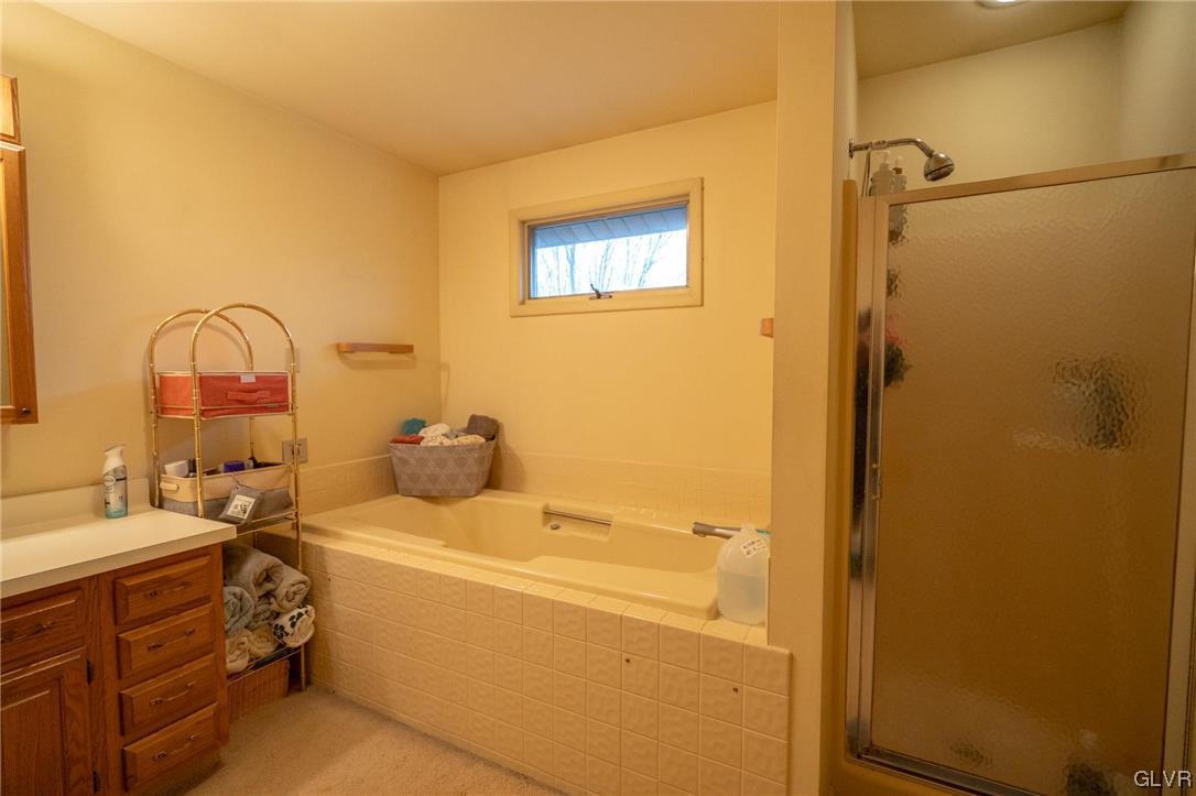 1540 Hidden Valley Road Allentown, PA 18103 - Photo 27 of 42 a bathroom with a sink mirror and tub
