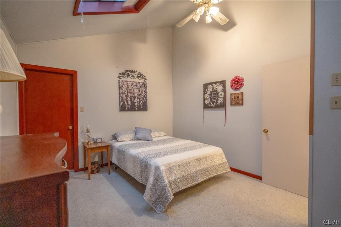 1540 Hidden Valley Road Allentown, PA 18103 - Photo 28 of 42 a bedroom with a bed and a chandelier