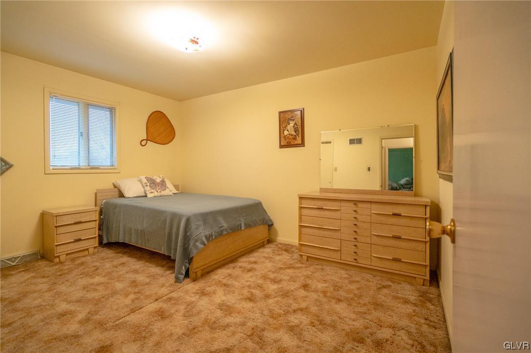1540 Hidden Valley Road Allentown, PA 18103 - Photo 31 of 42 a bedroom with a bed and cabinets