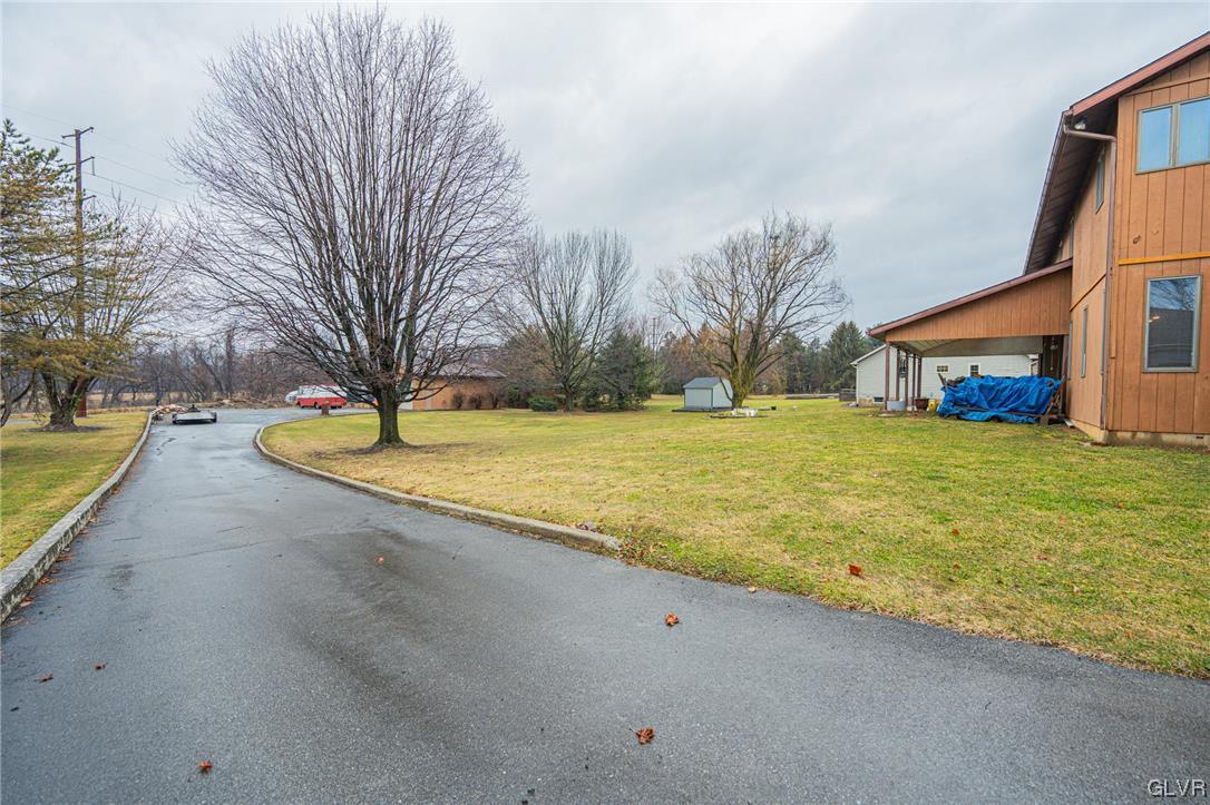 1540 Hidden Valley Road Allentown, PA 18103 - Photo 42 of 42 a view of a swimming pool with a yard and large trees