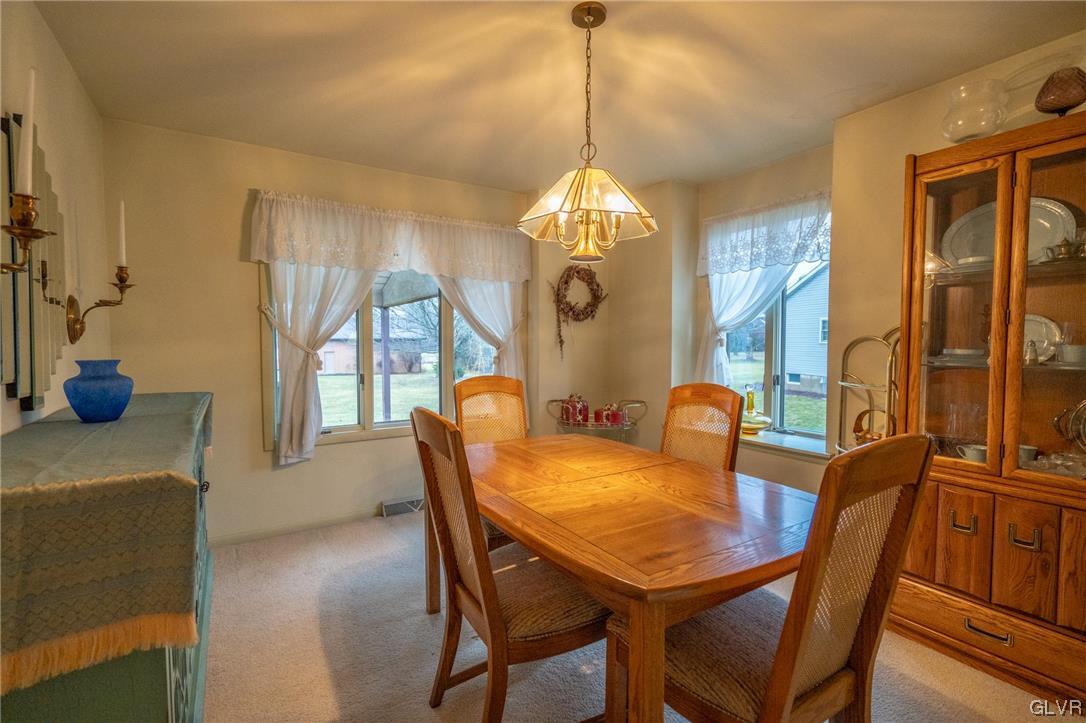 1540 Hidden Valley Road Allentown, PA 18103 - Photo 10 of 42 a view of a dining room with furniture window and wooden floor
