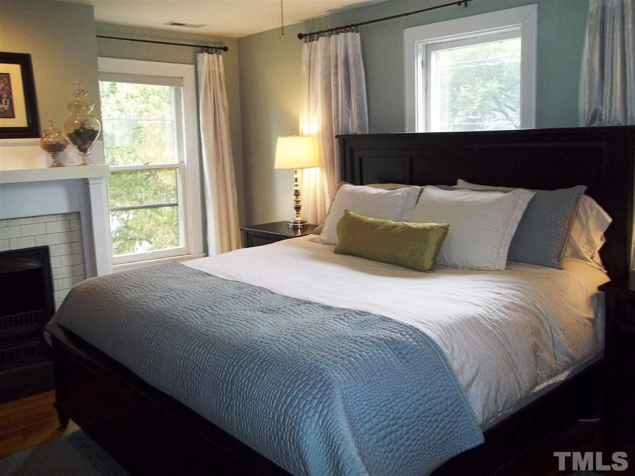 507 Cleveland Street Raleigh, NC 27605 - Photo 19 of 25 a bedroom with a bed and a window